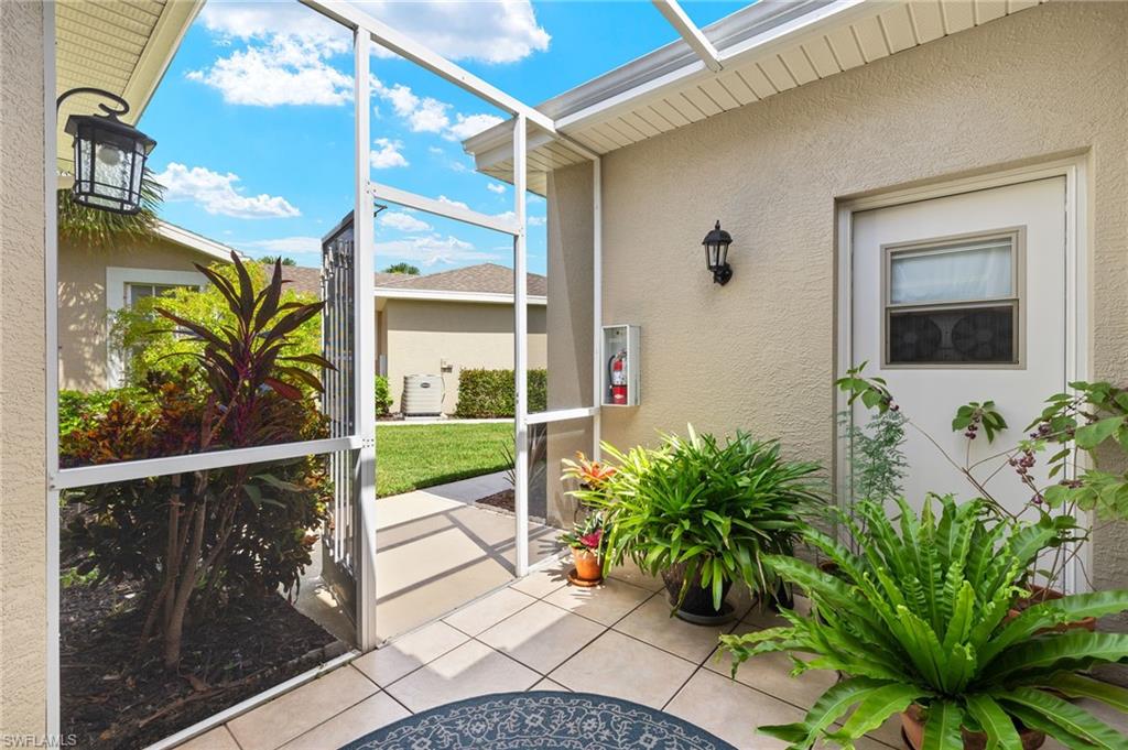 23164 Grassy Pine Drive Estero, FL 33928 - Photo 7 of 43 a view of a entryway door front of house