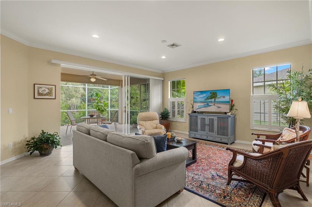 23164 Grassy Pine Drive Estero, FL 33928 - Photo 8 of 43 a living room with furniture and a large window