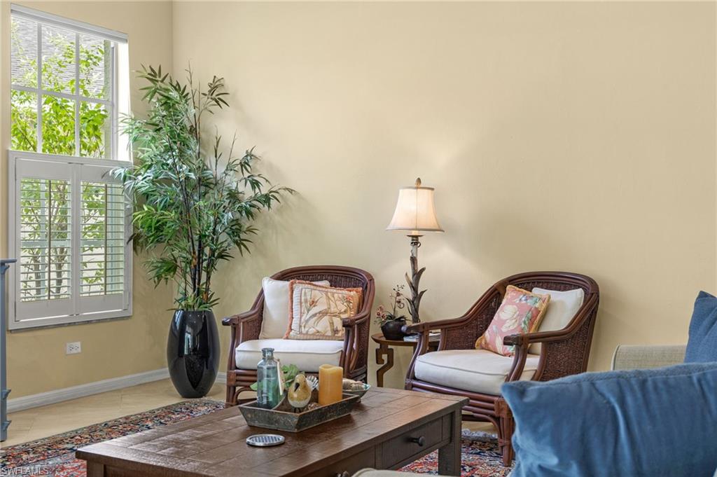 23164 Grassy Pine Drive Estero, FL 33928 - Photo 9 of 43 a living room with furniture and a potted plant