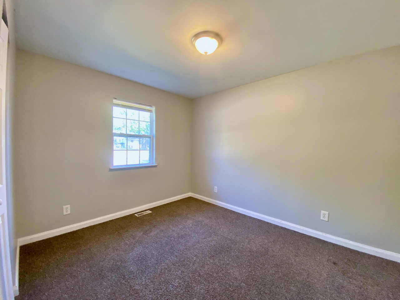 200 Durham Drive Steger, IL 60475 - Photo 13 of 26 an empty room with a empty space and windows