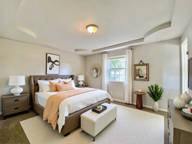 a bedroom with a bed and window