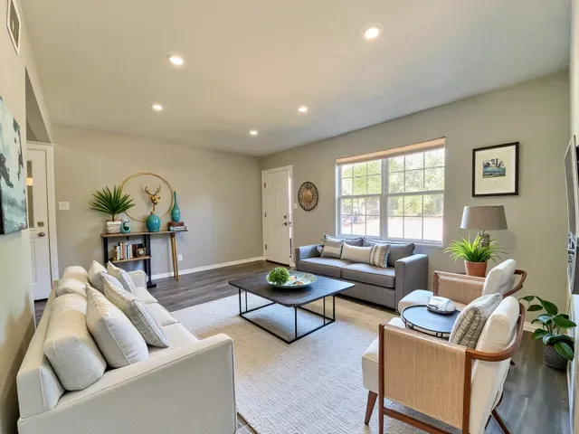 a living room with furniture and a large window
