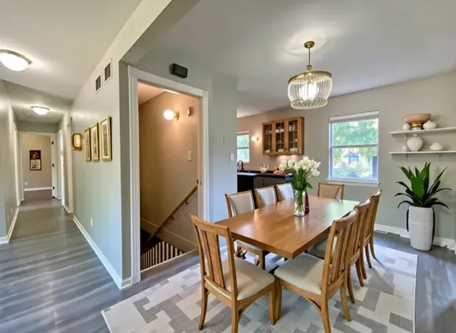 a view of a dining room with furniture and wooden floor