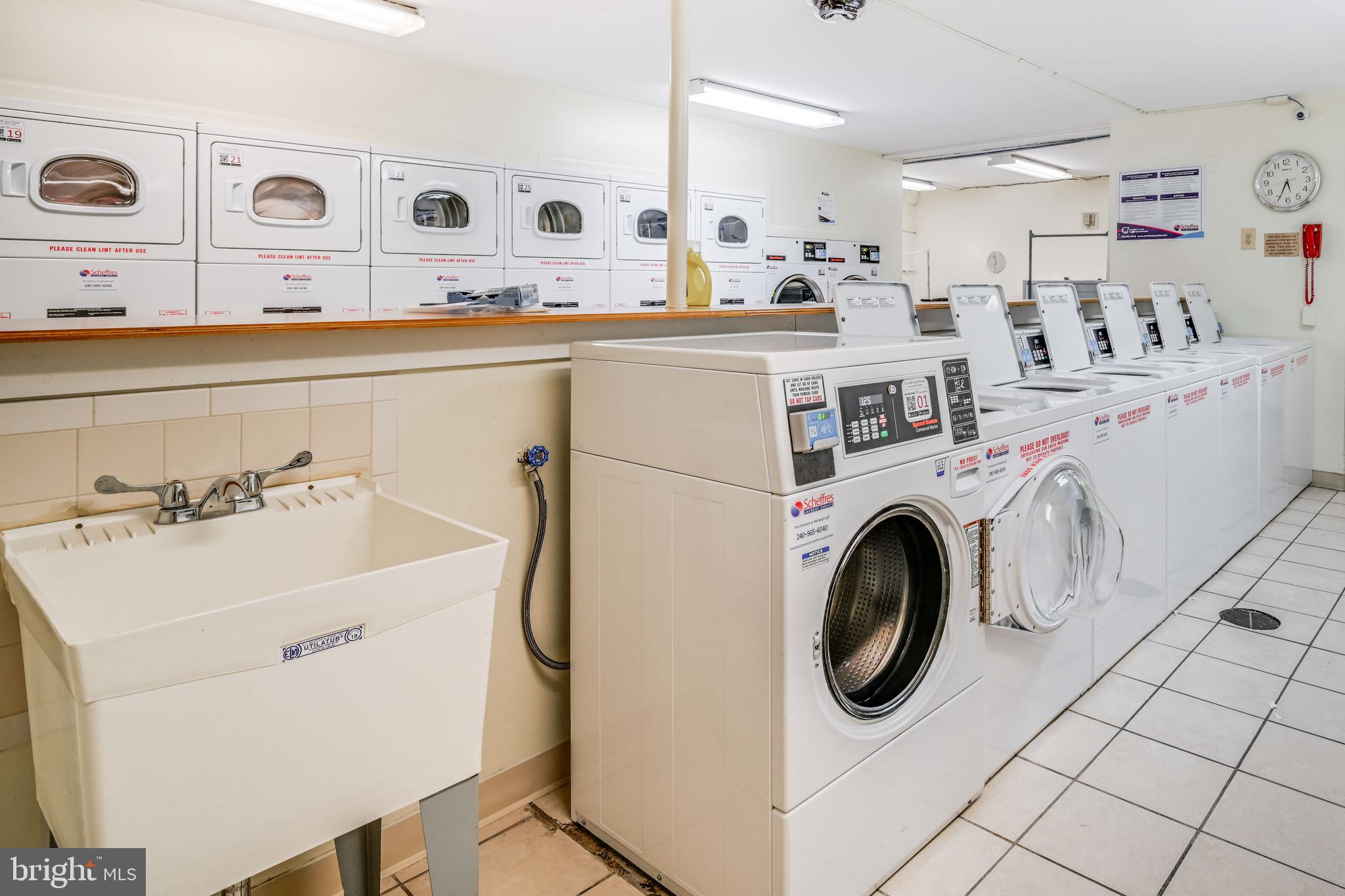 1111 University Boulevard West, Unit 611A Silver Spring, MD 20902 - Photo 17 of 26 a utility room with dryer and washer