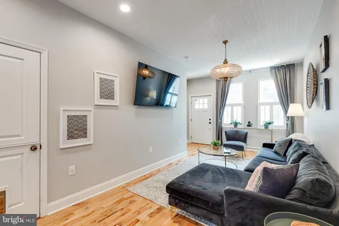 a kitchen with stainless steel appliances kitchen island granite countertop a sink and cabinets