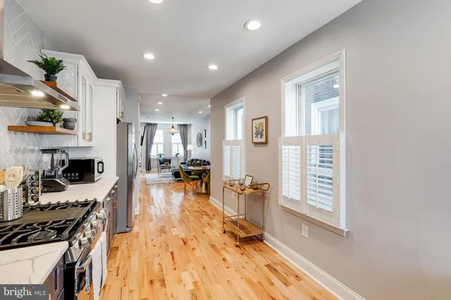 a view of a brick house with many windows
