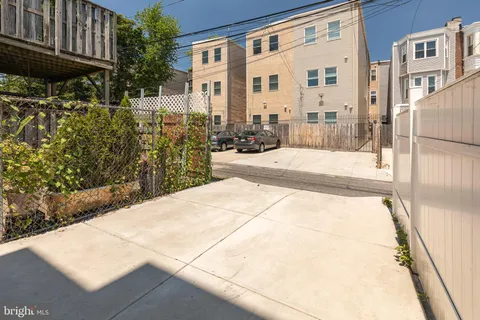 a balcony with furniture and a potted plant