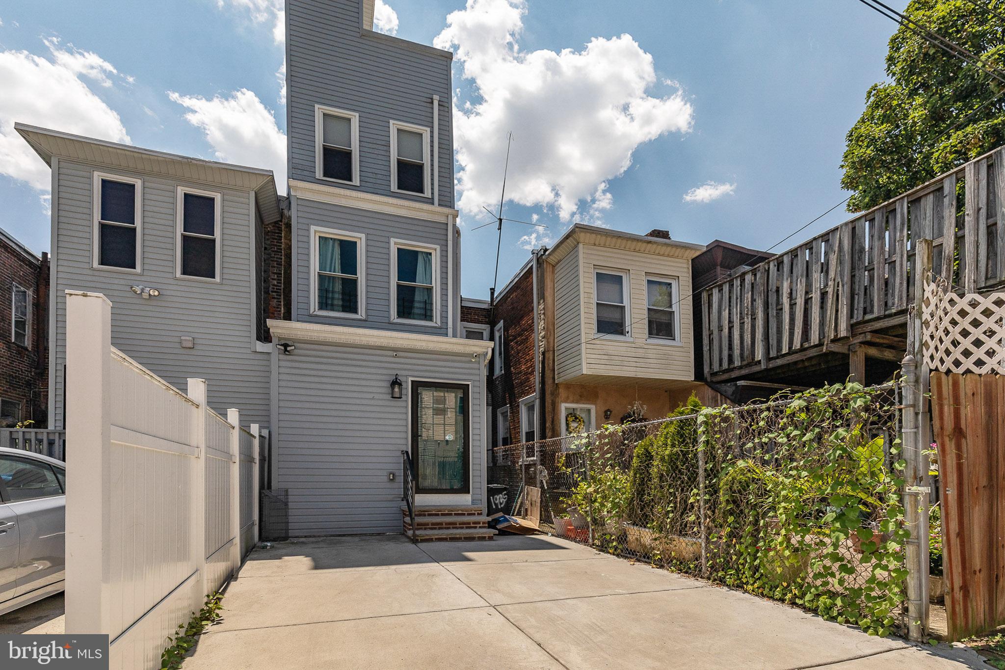 1935 Cambridge Street Philadelphia, PA 19130 - Photo 17 of 54 a view of a house with a wooden fence