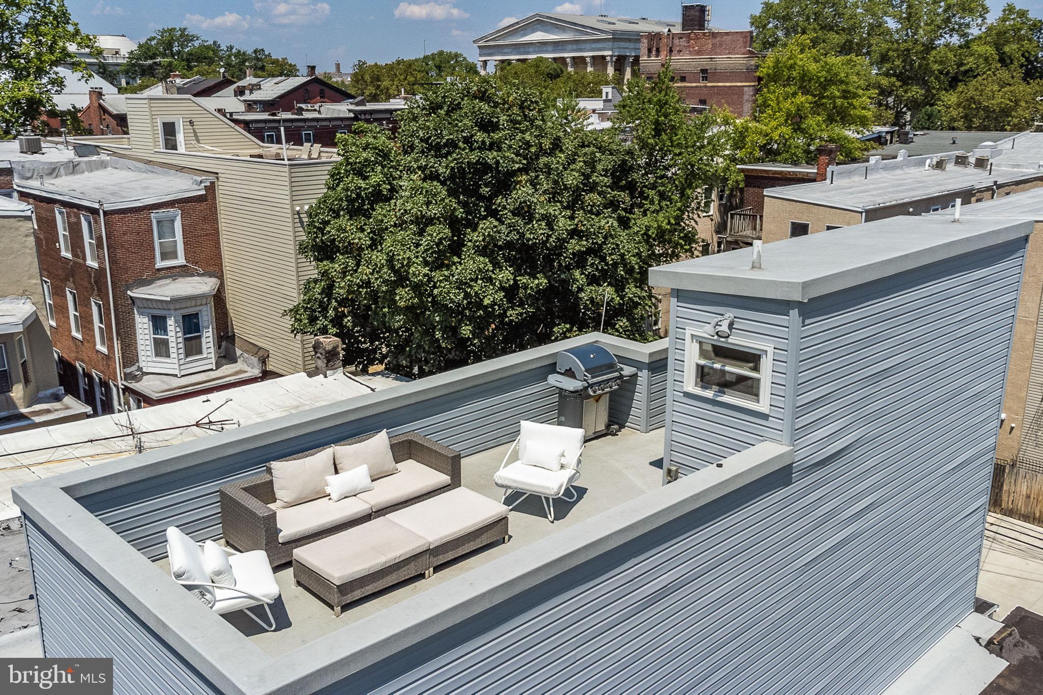 1935 Cambridge Street Philadelphia, PA 19130 - Photo 18 of 54 a balcony with furniture and a potted plant