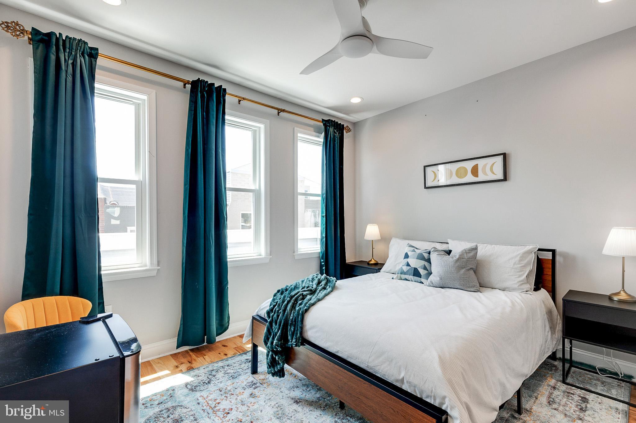 1935 Cambridge Street Philadelphia, PA 19130 - Photo 20 of 54 a bedroom with a bed and window