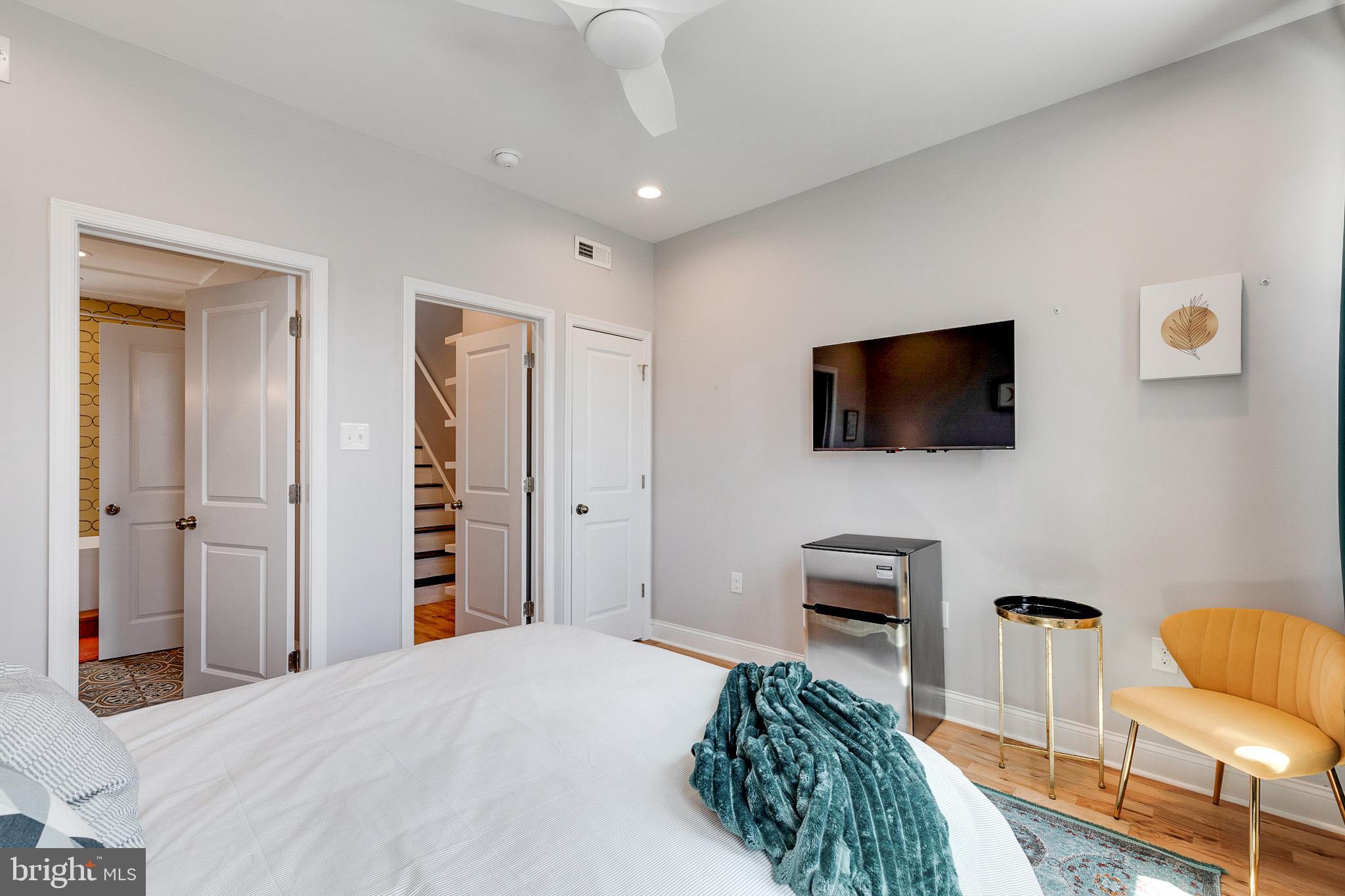 1935 Cambridge Street Philadelphia, PA 19130 - Photo 21 of 54 a bedroom with a bed and a flat screen tv