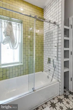 a bed room with furniture and a bathtub