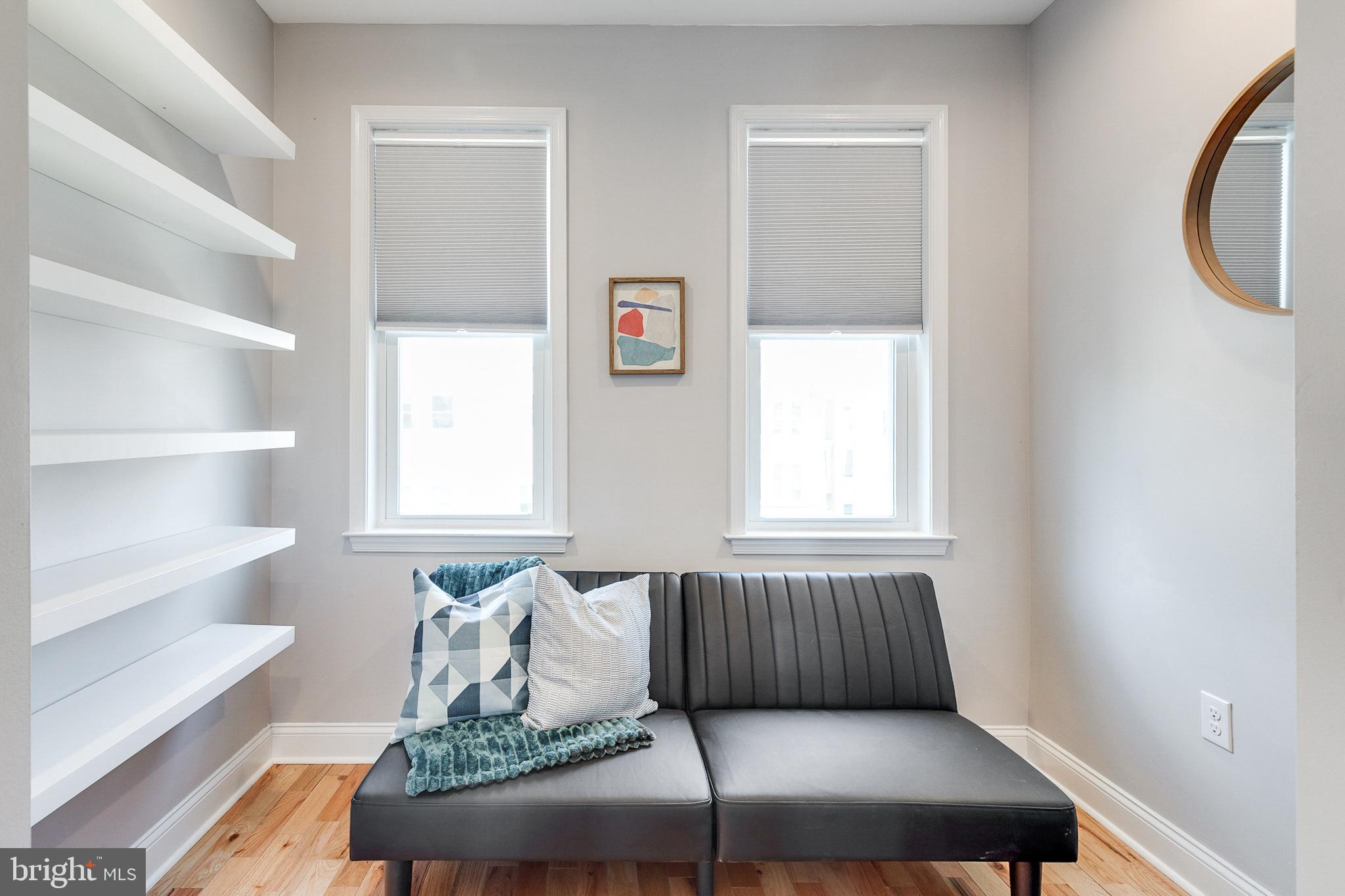1935 Cambridge Street Philadelphia, PA 19130 - Photo 29 of 54 a living room with furniture and a window