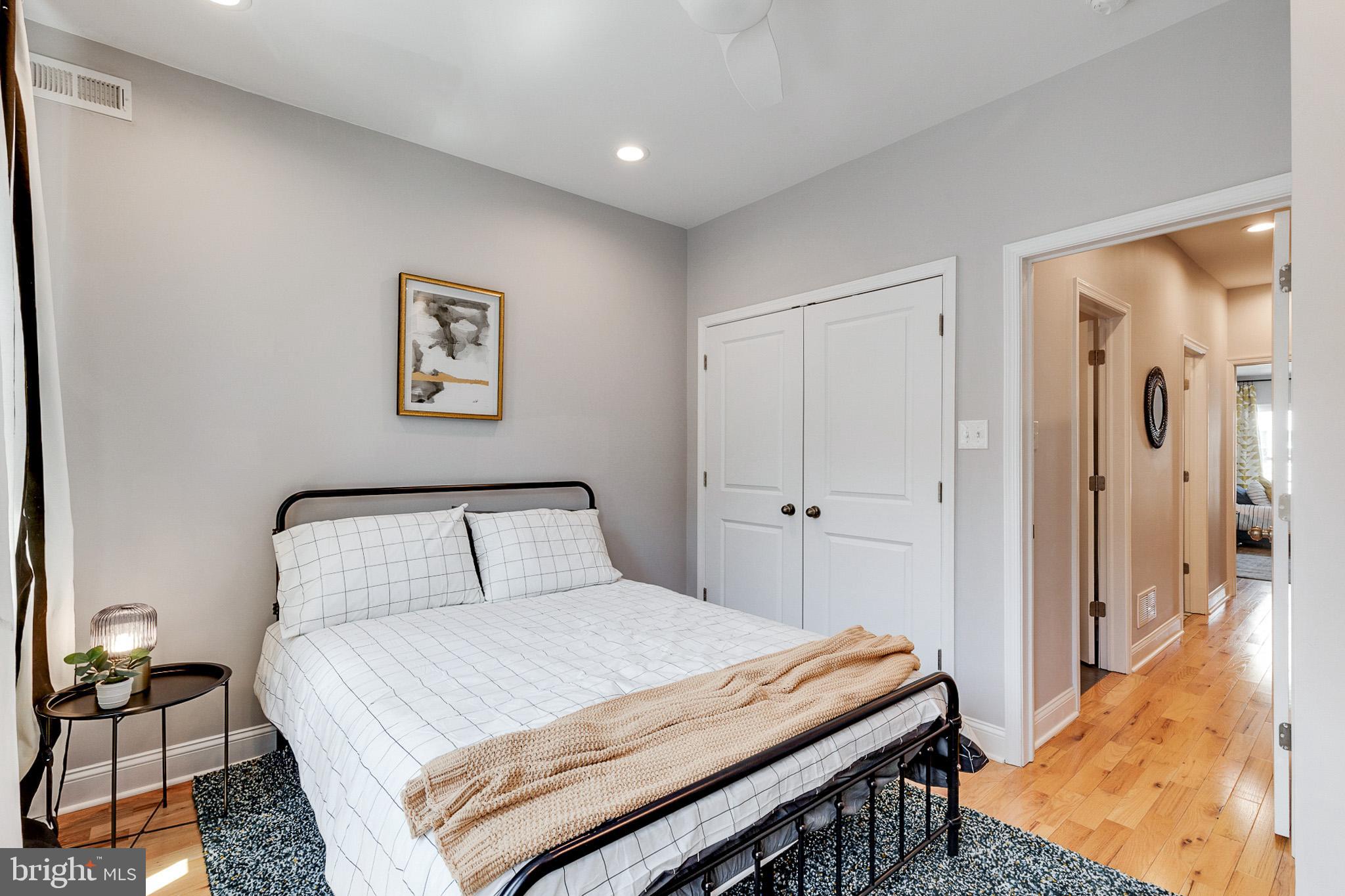 1935 Cambridge Street Philadelphia, PA 19130 - Photo 30 of 54 a bedroom with a bed and a painting on the wall