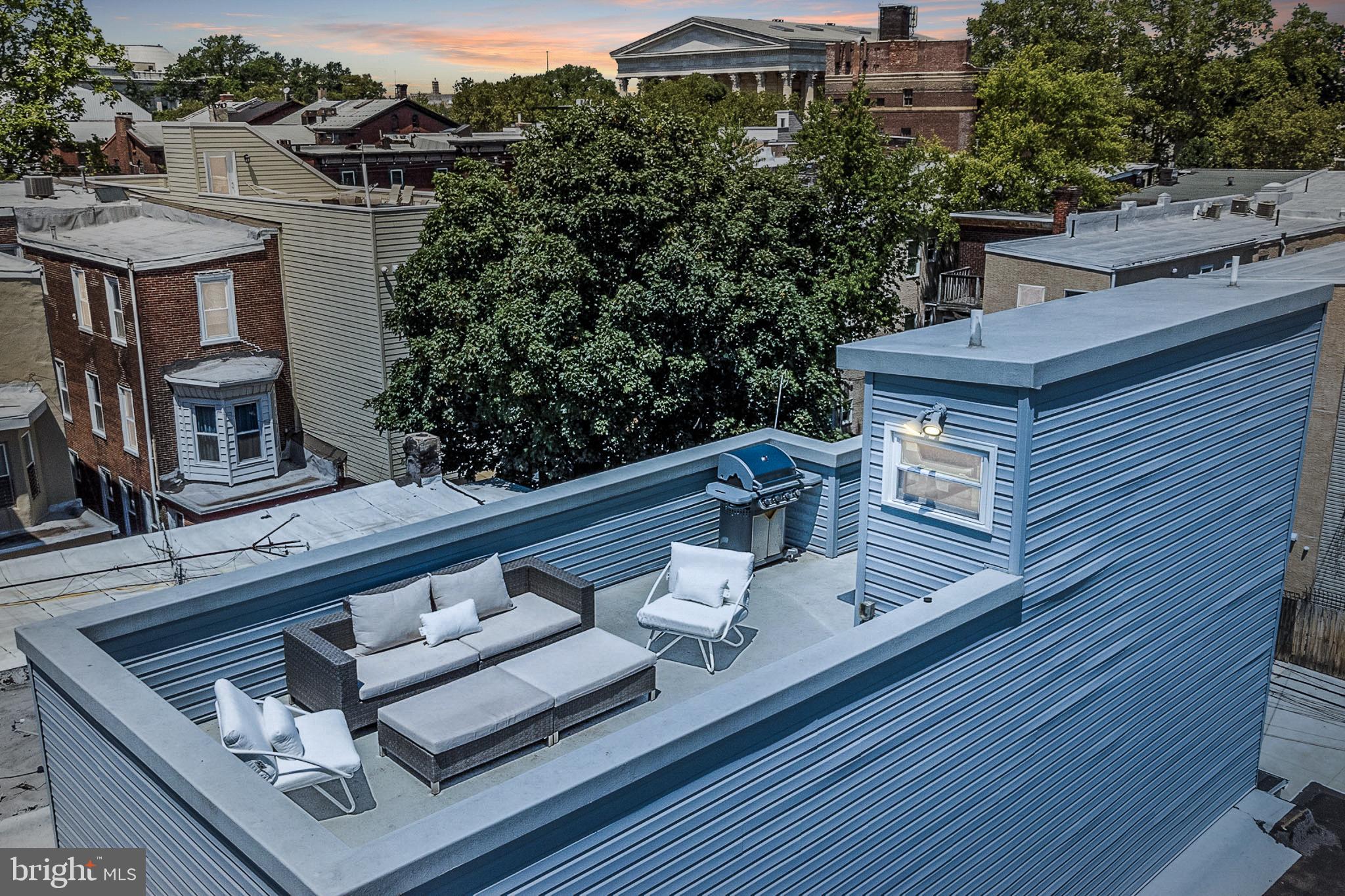 1935 Cambridge Street Philadelphia, PA 19130 - Photo 3 of 54 a view of a balcony with chairs and wooden floor