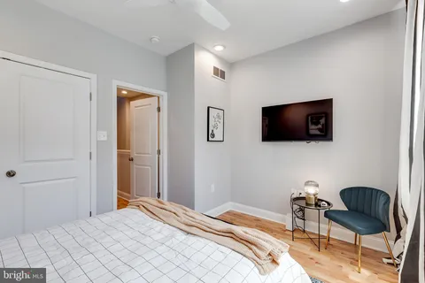 a bathroom with a bathtub sink and mirror