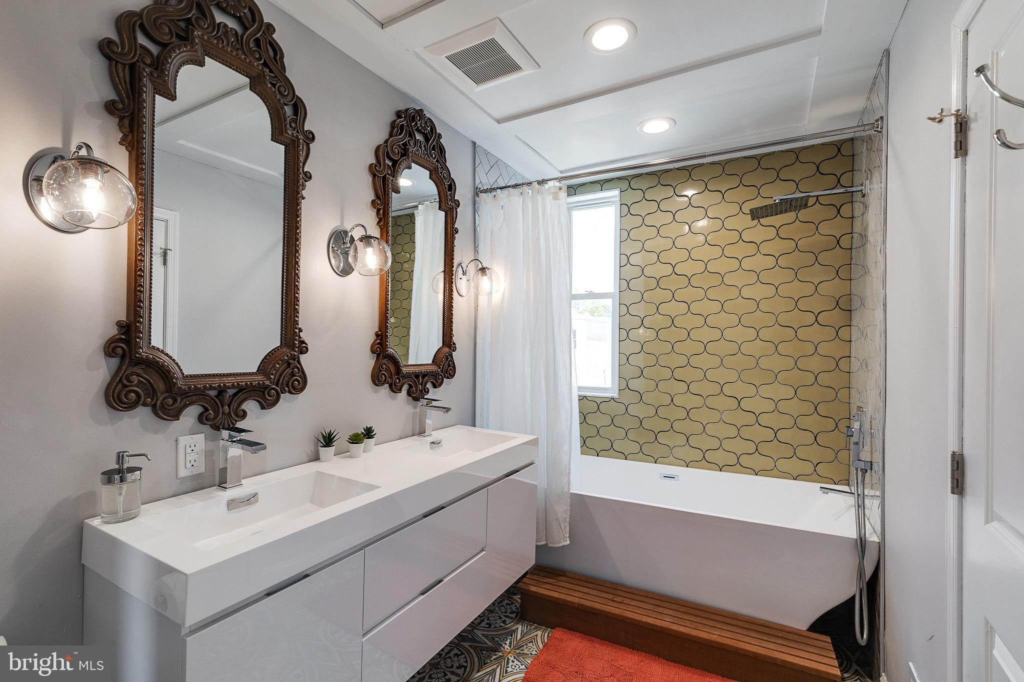 1935 Cambridge Street Philadelphia, PA 19130 - Photo 32 of 54 a bathroom with a sink and a mirror