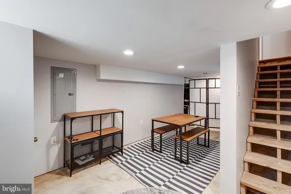 a buildings covered with tall trees