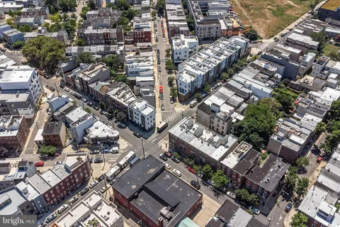 an aerial view of a city with lots of residential buildings