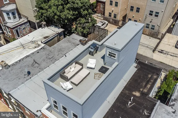 an aerial view of residential houses with outdoor space