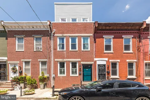 a view of city from terrace with seating space