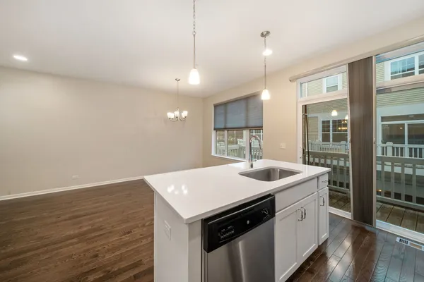 a kitchen with a sink and stove