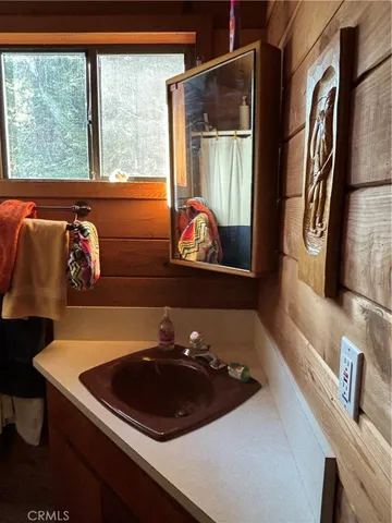 a room with pool table and a window