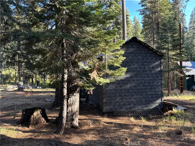 a view of backyard with sitting area