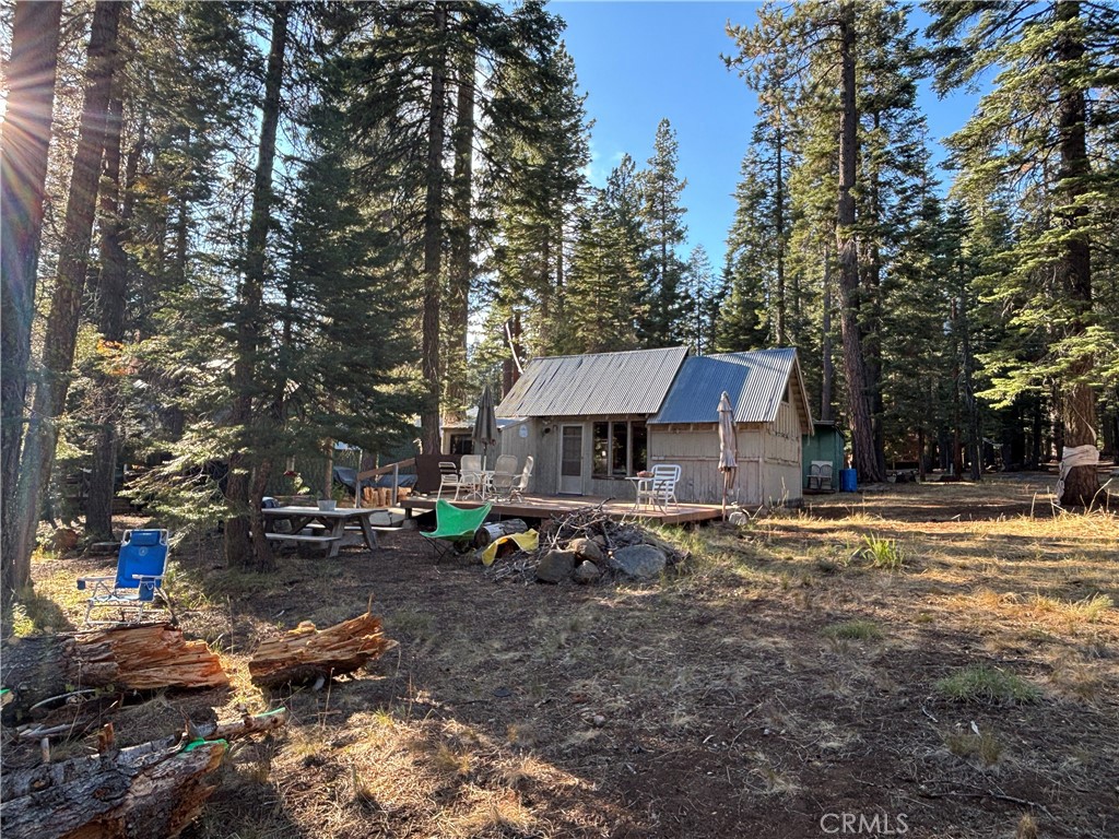 9478 Jones Creek Road, Unit 14 Forest Ranch, CA 95942 - Photo 29 of 35 a backyard of a house with barbeque oven tree and outdoor seating