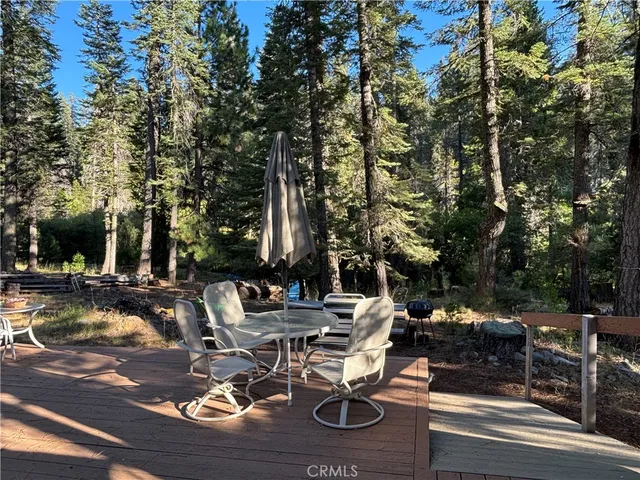 a view of a house with a tree