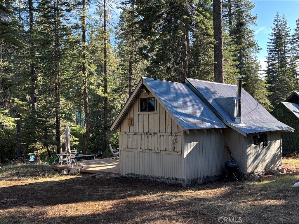 9478 Jones Creek Road, Unit 14 Forest Ranch, CA 95942 - Photo 5 of 35 a house with trees in the background