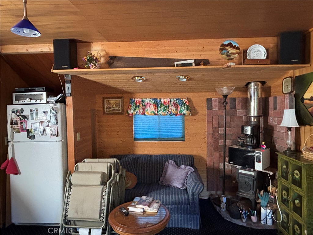 9478 Jones Creek Road, Unit 14 Forest Ranch, CA 95942 - Photo 9 of 35 a living room with furniture and a fireplace