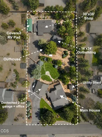 an aerial view of residential houses with outdoor space