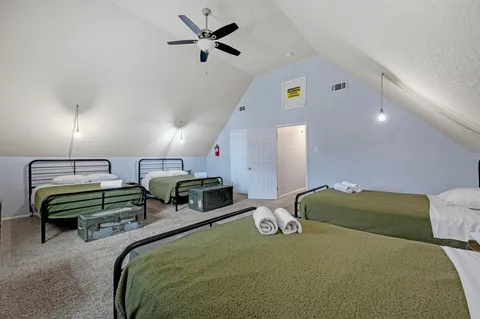 a bedroom with bed and a couch