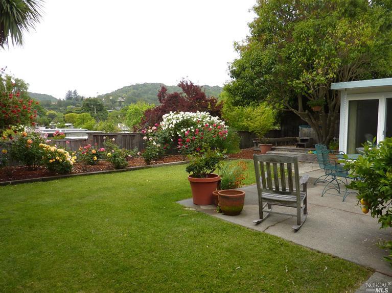 735 Las Colindas Road San Rafael, CA 94903 - Photo 1 of 1 a view of a chair and table in the garden