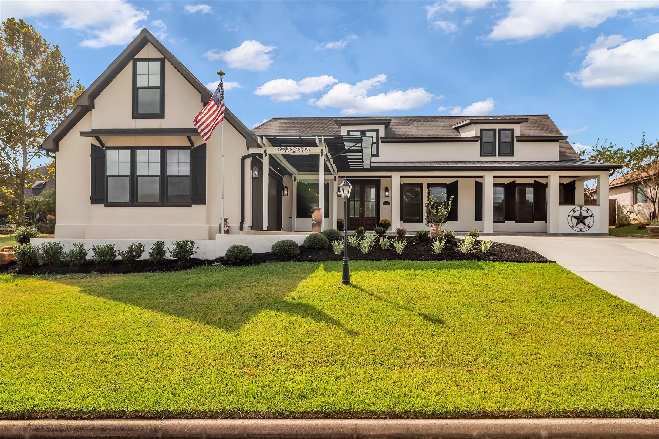 a front view of a house with swimming pool having outdoor seating