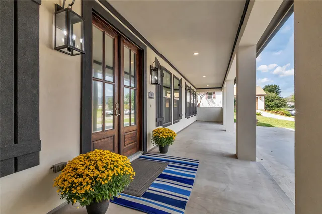 a lobby with furniture and floor to ceiling window