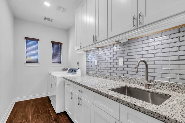 a kitchen with a sink and cabinets