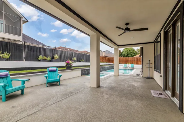a view of swimming pool with seating space