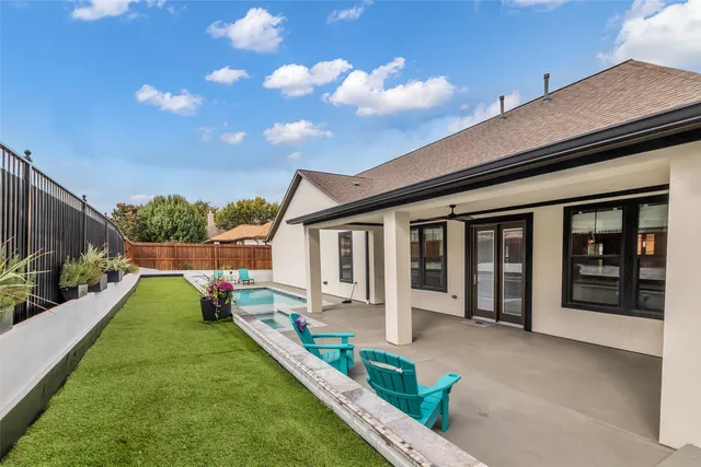 a view of house with backyard space and garden