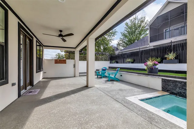 a living room filled with furniture and a large window