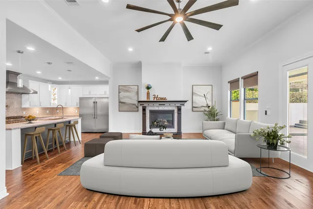 a living room with furniture and a fireplace