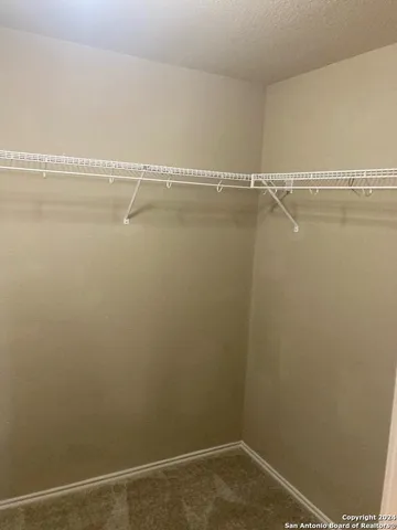 a view of a room with racks on the wall