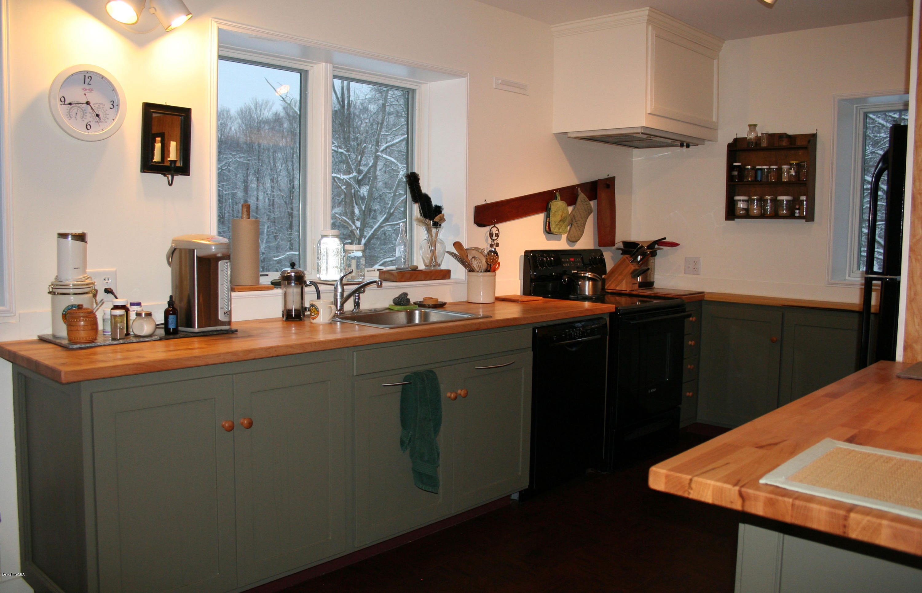 945 State Road Richmond, MA 01254 - Photo 11 of 32 a kitchen with stainless steel appliances a sink stove and refrigerator