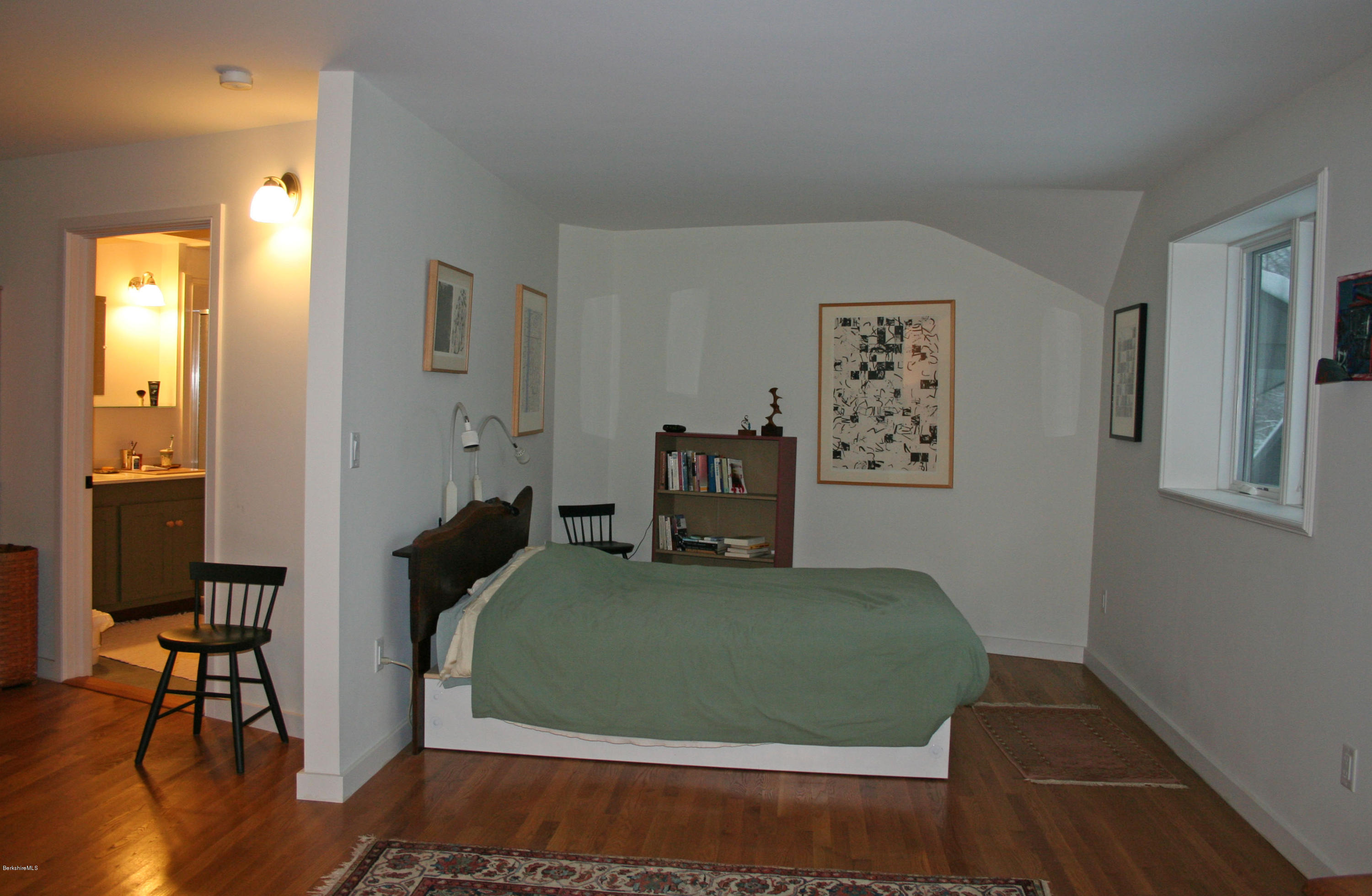 945 State Road Richmond, MA 01254 - Photo 14 of 32 a bedroom with a bed and wooden floor