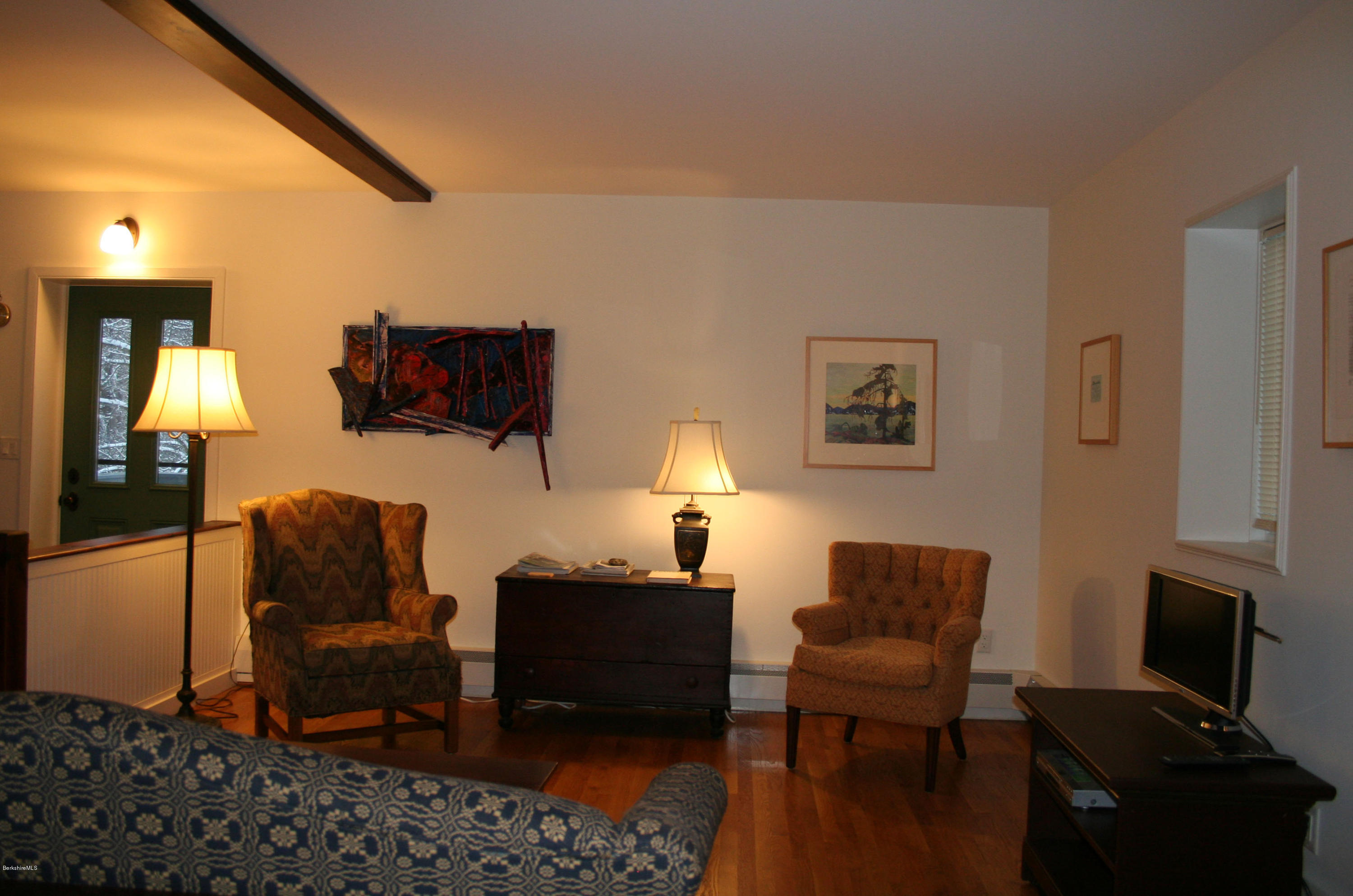 945 State Road Richmond, MA 01254 - Photo 9 of 32 a living room with furniture a lamp and a flat screen tv