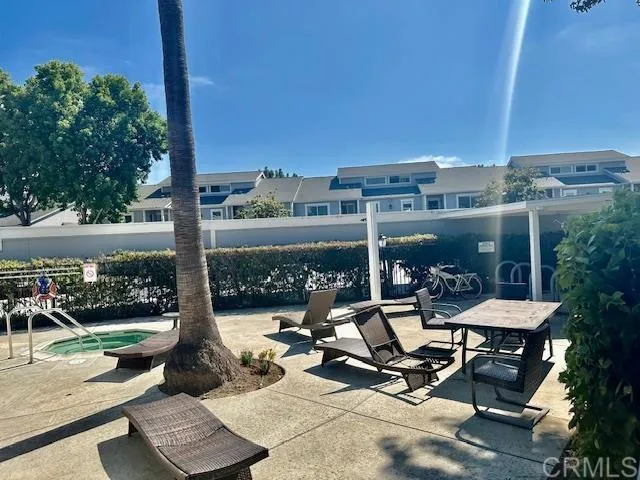 a view of a terrace with seating area and furniture