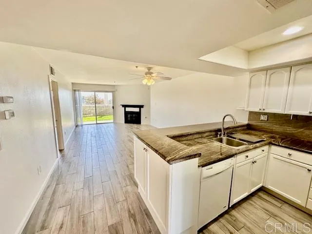a kitchen with a sink and cabinets