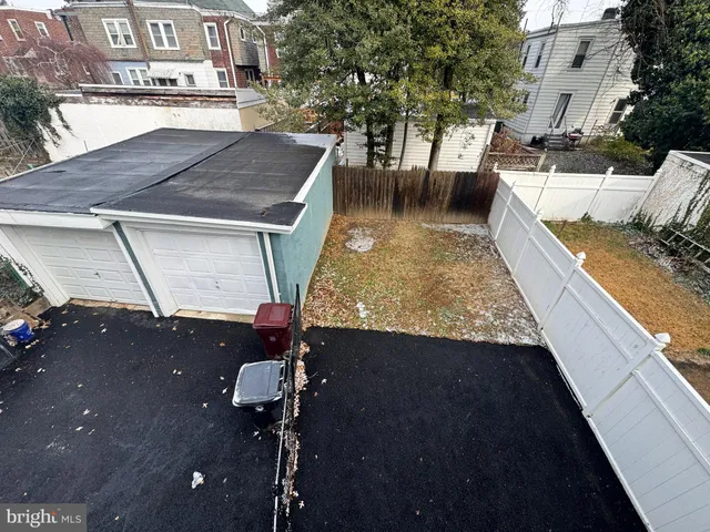 a view of a backyard with sitting area