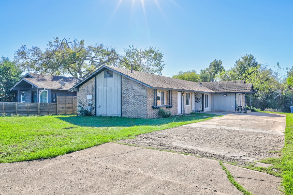 a front view of a house with a yard and a garage